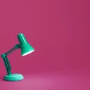Green desk lamp product photo on a solid magenta backdrop — sample image for the background changer